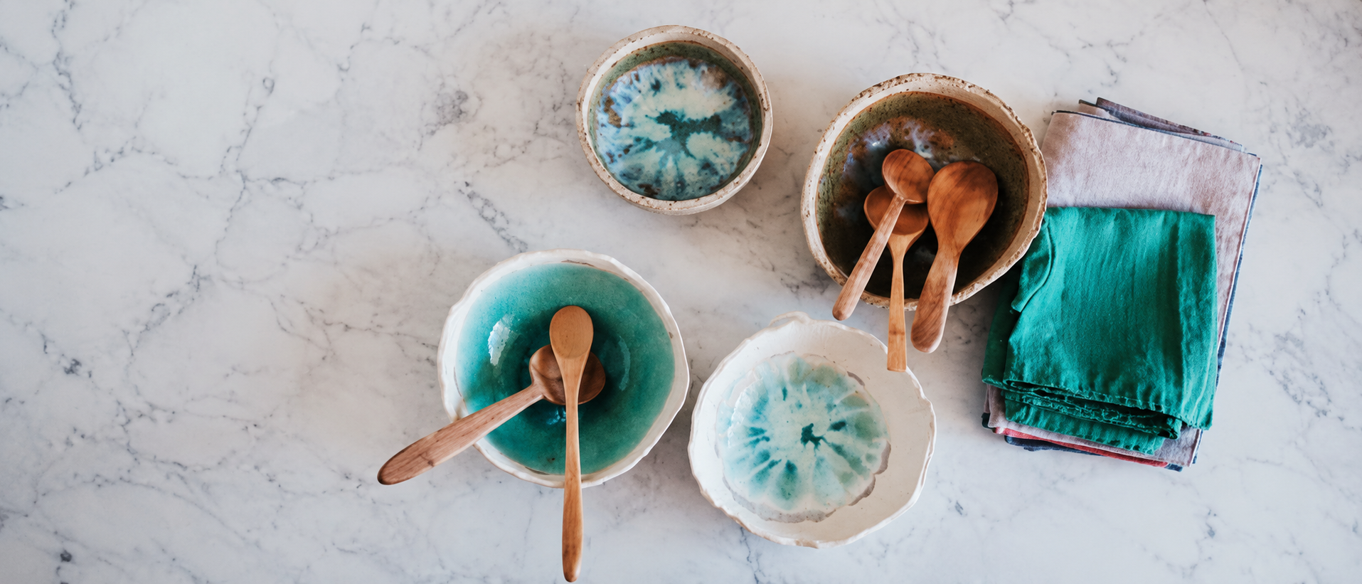 Modern ceramic tableware arranged on a marble table