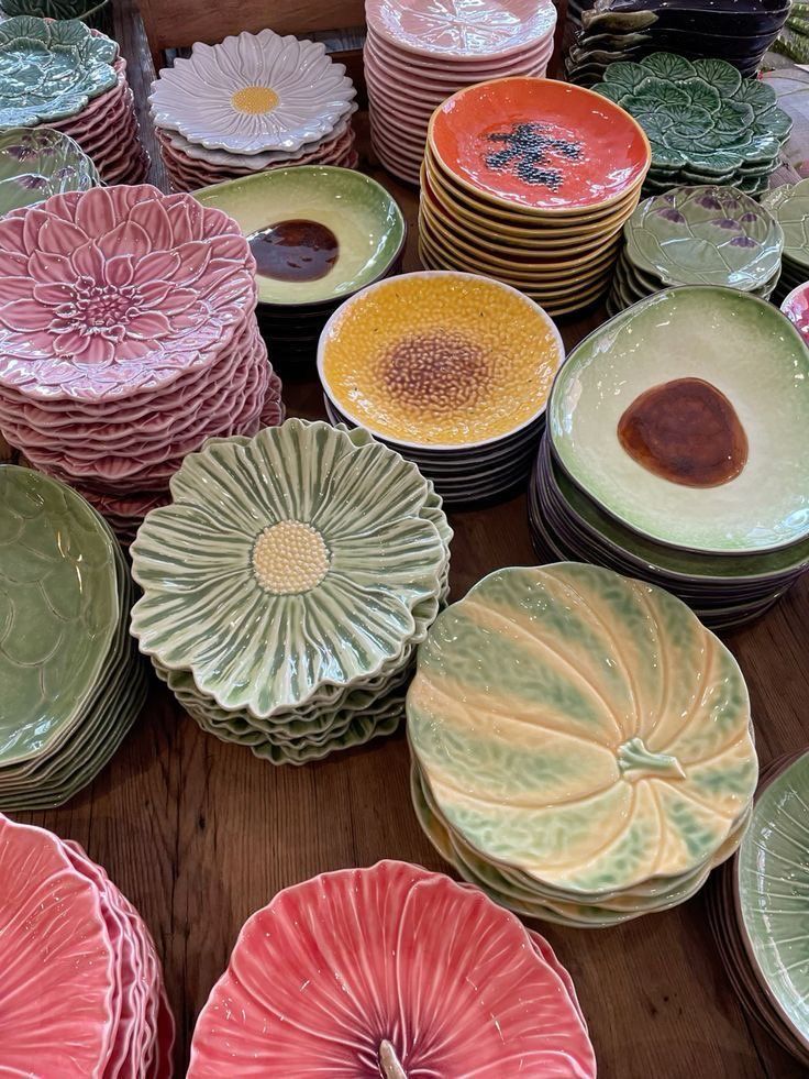 Colorful ceramic plates arranged on a light surface